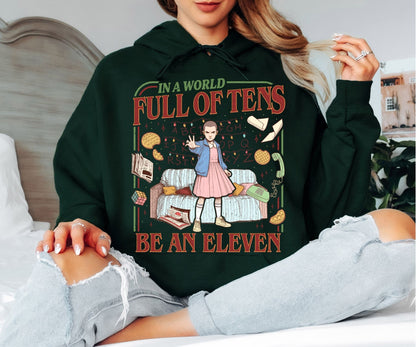 In a World Full of Tens Be an Eleven Hoodie – Retro Sci-Fi Quote Graphic Hoodie, Funny Motivational Unisex Sweatshirt