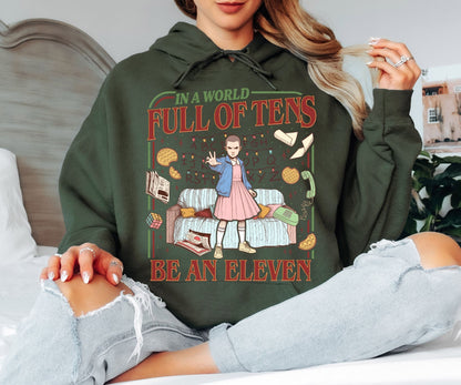 In a World Full of Tens Be an Eleven Hoodie – Retro Sci-Fi Quote Graphic Hoodie, Funny Motivational Unisex Sweatshirt